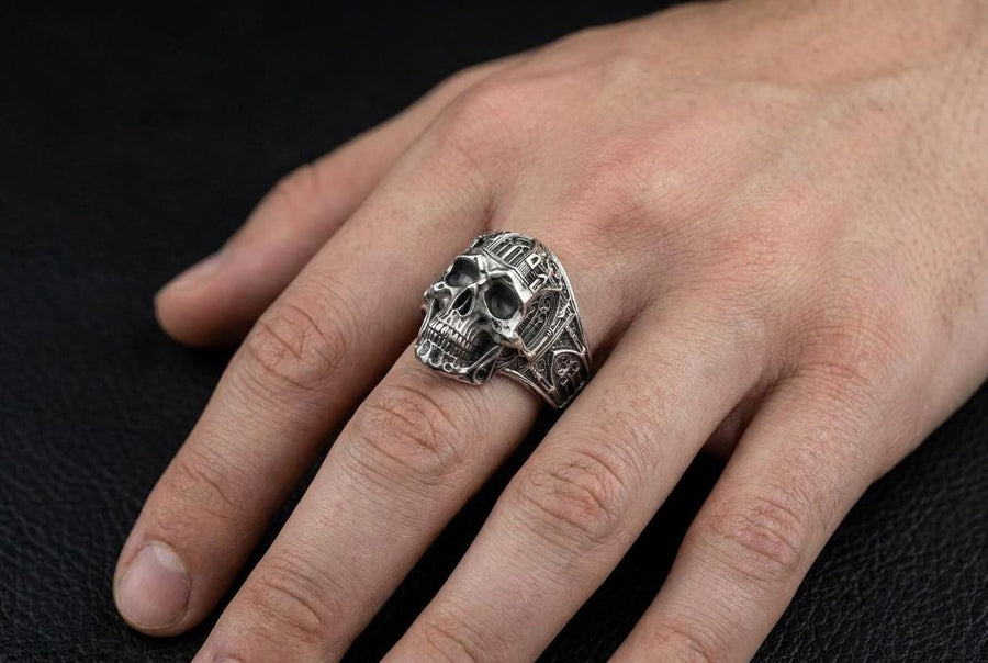 The exceptional micro-casting and silversmithing techniques used to construct this wearable sculpture are evident in its staggering detail. The relief work perfectly captures the delicate mullions of the stained glass windows alongside the anatomical jawline of the skull. The ring features a substantial thickness, with smooth inner bands polished flat to ensure a comfortable, everyday fit suitable for lifelong wear.