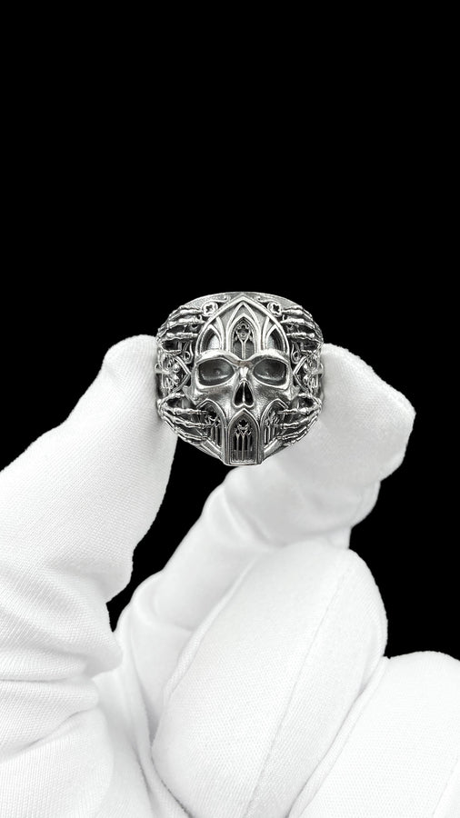 Crafted from premium solid 925 sterling silver, this substantial ring demonstrates the visual impact of an oxidized patina. The antiquing treatment settles into the microscopic crevices of the detailed gothic tracery and side cross engraving, providing a permanent shadow and an ancient, textured character.