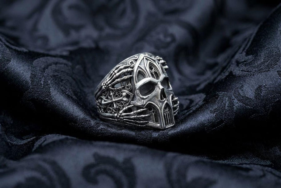 Crafted from premium solid 925 sterling silver, this substantial ring demonstrates the visual impact of an oxidized patina. The antiquing treatment settles into the microscopic crevices of the detailed gothic tracery and side cross engraving, providing a permanent shadow and an ancient, textured character.