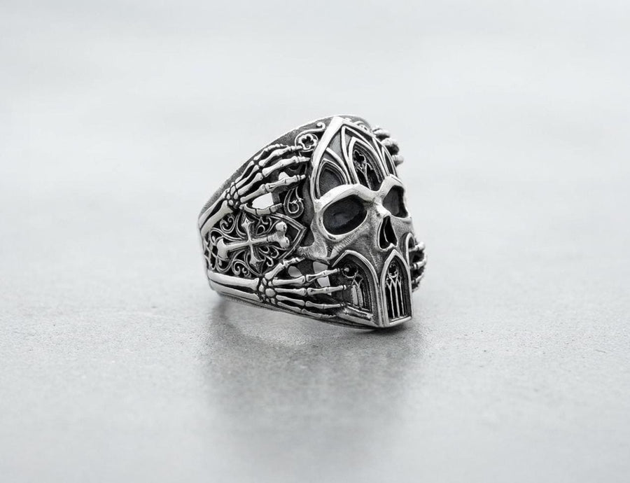 Crafted from premium solid 925 sterling silver, this substantial ring demonstrates the visual impact of an oxidized patina. The antiquing treatment settles into the microscopic crevices of the detailed gothic tracery and side cross engraving, providing a permanent shadow and an ancient, textured character.
