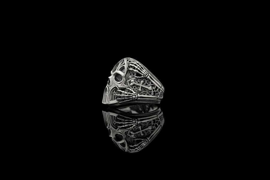 Crafted from premium solid 925 sterling silver, this substantial ring demonstrates the visual impact of an oxidized patina. The antiquing treatment settles into the microscopic crevices of the detailed gothic tracery and side cross engraving, providing a permanent shadow and an ancient, textured character.