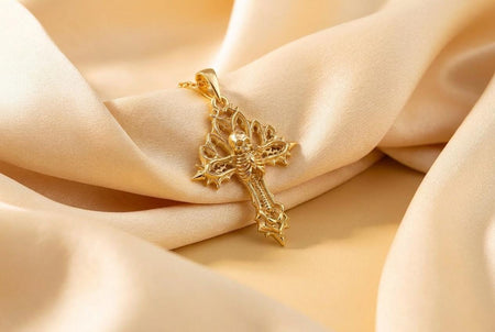 Reimagined in opulent 18k solid yellow gold, this gothic skeleton cross pendant transforms from a dark silver artifact into a radiant treasure. The warm tones illuminate the detailed skull, spine, and pointed cathedral arches. Instead of dark oxidation, a subtle matte brushed finish rests in the recessed architectural alcoves, allowing the highly polished bones and openwork tracery to gleam with classic luster.