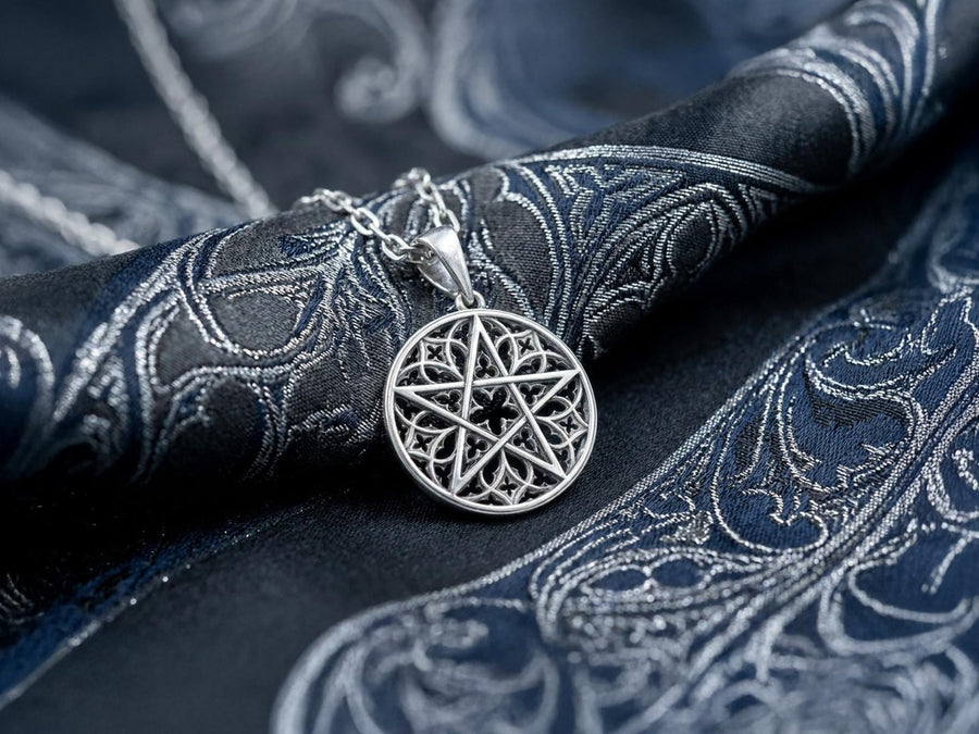 A close-up studio photograph of image_61ba46.png, a circular 925 sterling silver pendant on a black background. The design features a bold, sharp pentagram overlapping an intricate background of openwork gothic cathedral tracery and carved quatrefoil motifs. This striking artisan pendant captures the mesmerizing geometry of medieval architecture. Bright studio lighting illuminates the highly polished lines of the silver five-pointed star, contras