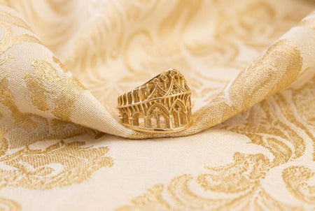 Reimagined in 18k solid yellow gold, this gothic architecture ring transforms into a radiant sunlit artifact. The warm tones illuminate the sharp arches and openwork medieval tracery. A subtle matte finish replaces the dark oxidation, gleaming with a luxurious, classic luster.
