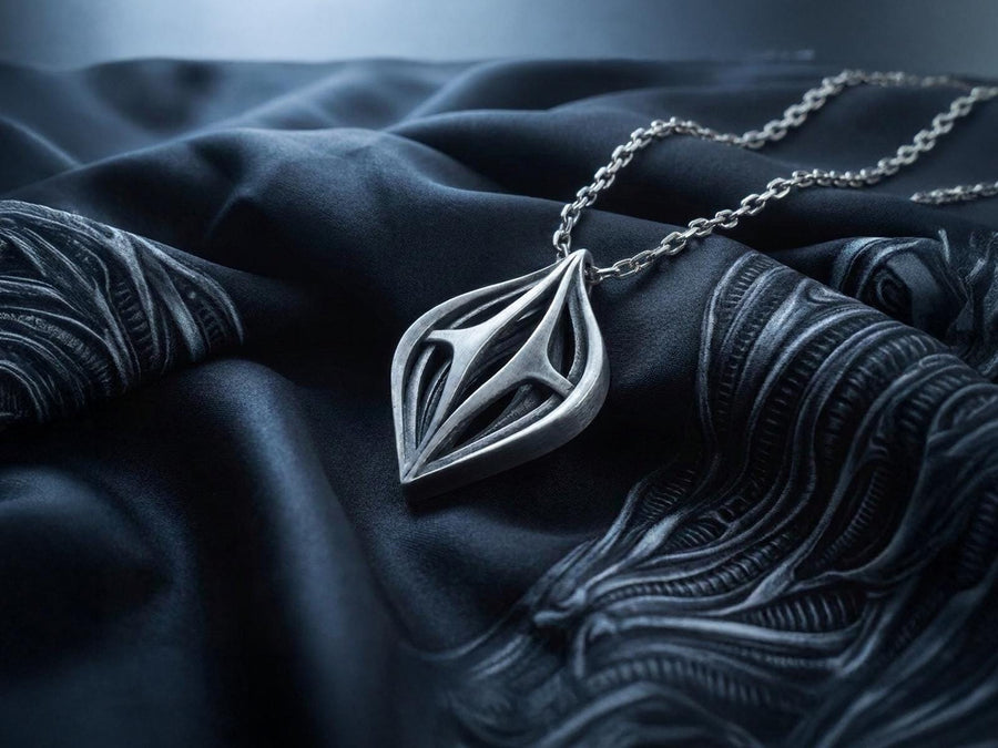 Atmospheric shot of a solid sterling silver alien artifact necklace, featuring sweeping organic geometric arches.
