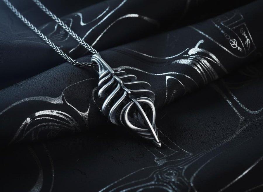 Avant-garde dark fantasy jewelry piece: a striking 3D skeletal silver drop charm hanging from an anchor chain.