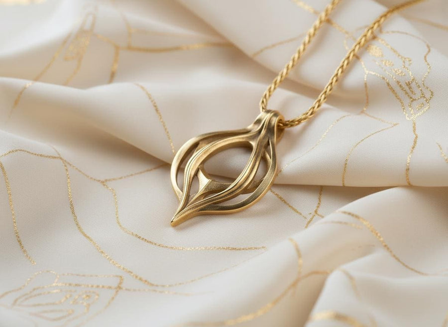 Oxidized biomechanical teardrop pendant suspended on an anchor chain, emphasizing its airy cut-out structure.