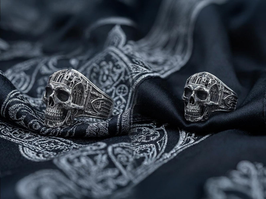 The exceptional micro-casting and silversmithing techniques used to construct this wearable sculpture are evident in its staggering detail. The relief work perfectly captures the delicate mullions of the stained glass windows alongside the anatomical jawline of the skull. The ring features a substantial thickness, with smooth inner bands polished flat to ensure a comfortable, everyday fit suitable for lifelong wear.