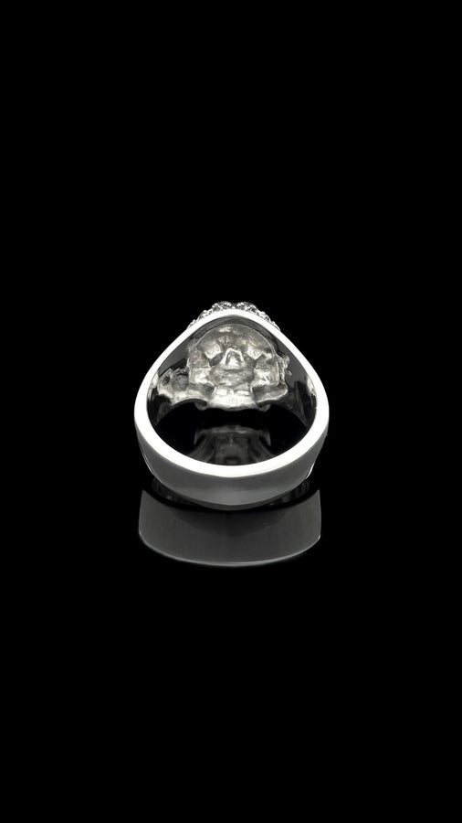 The exceptional micro-casting and silversmithing techniques used to construct this wearable sculpture are evident in its staggering detail. The relief work perfectly captures the delicate mullions of the stained glass windows alongside the anatomical jawline of the skull. The ring features a substantial thickness, with smooth inner bands polished flat to ensure a comfortable, everyday fit suitable for lifelong wear.