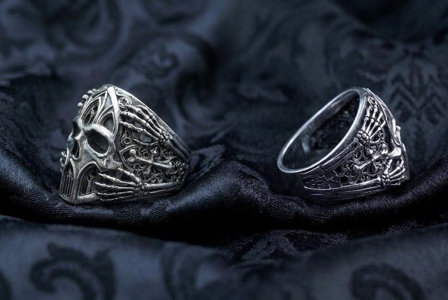 Crafted from premium solid 925 sterling silver, this substantial ring demonstrates the visual impact of an oxidized patina. The antiquing treatment settles into the microscopic crevices of the detailed gothic tracery and side cross engraving, providing a permanent shadow and an ancient, textured character.