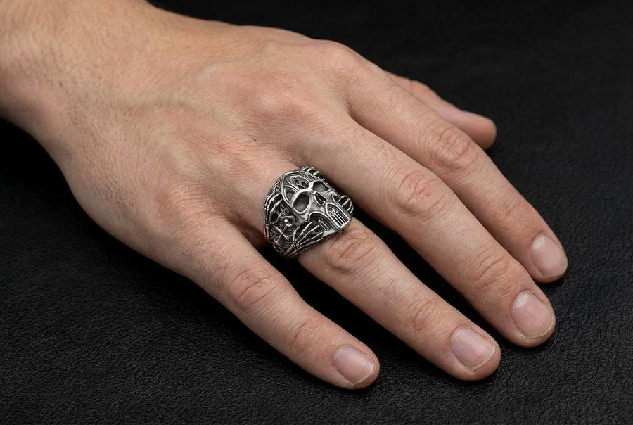 Crafted from premium solid 925 sterling silver, this substantial ring demonstrates the visual impact of an oxidized patina. The antiquing treatment settles into the microscopic crevices of the detailed gothic tracery and side cross engraving, providing a permanent shadow and an ancient, textured character.