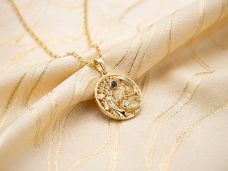 Reimagined in opulent 18k solid yellow gold, this Asian-inspired landscape pendant transforms into a radiant artifact. The warm tones illuminate the geisha, koi fish, and pagoda. A subtle matte finish replaces the dark oxidation, allowing the black onyx and clear gemstone to gleam beautifully.