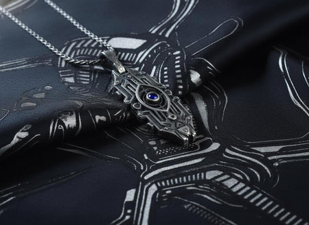 Intricate cyberpunk design inspired by high-tech circuitry and sci-fi artifacts. Exceptional silversmithing is evident in this oxidized silver avant-garde necklace. The relief work perfectly balances the sharp lines of the outer mechanical border with the central red gemstone core. A bold cyberpunk statement piece for alternative collectors.