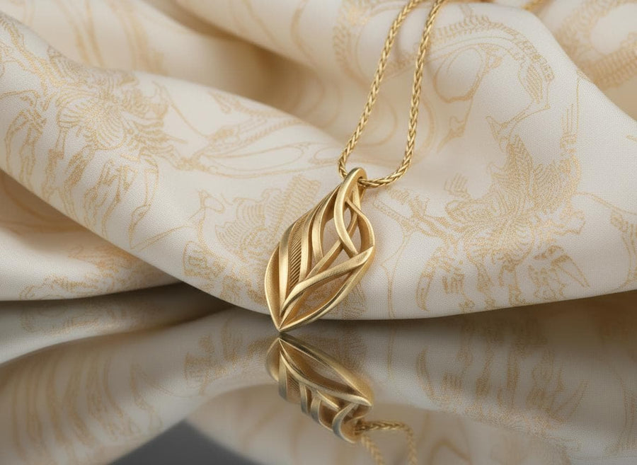 Dark fantasy silver teardrop pendant resting on black fabric, showing sweeping organic lines and an oxidized micro-ribbed background.