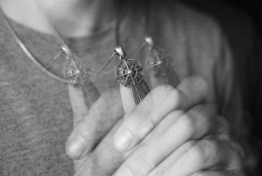 Unlock the aesthetic of ancient battles and celestial navigation with this solid 925 sterling silver sword compass pendant. Inspired by dark fantasy lore and esoteric warrior artifacts, this avant-garde piece features a striking eight-pointed star merging into a sleek, grooved blade silhouette. A profound avant-garde statement piece perfect for medieval, gothic, and techwear styles.