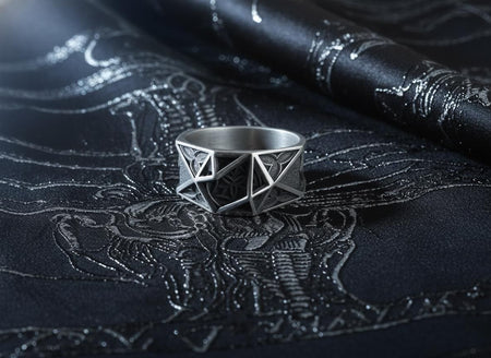 Handcrafted from solid 925 Sterling Silver with a deep oxidized finish to highlight its architectural lines.
