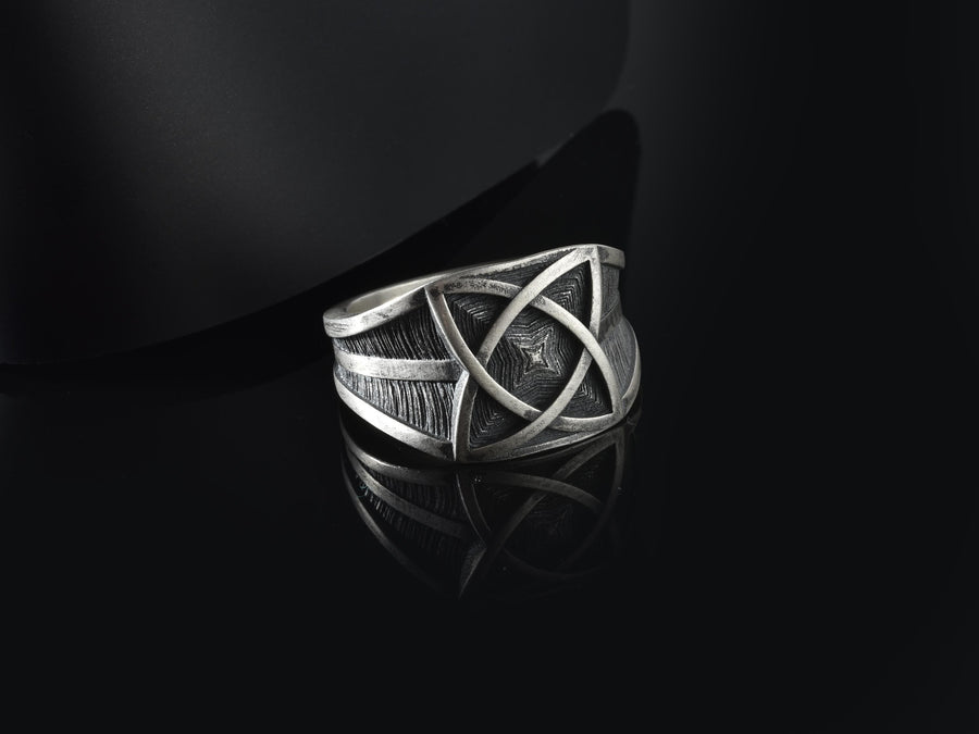 Handcrafted from solid 925 Sterling Silver with a deep oxidized finish to accentuate its textured details.