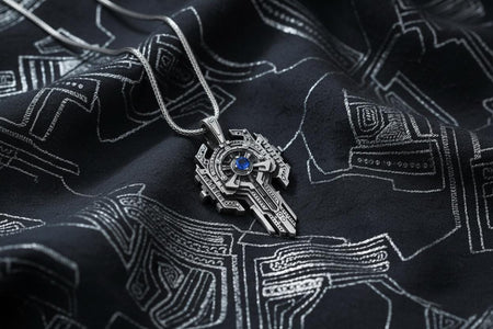 Angled view of a cyberpunk silver cross pendant with a blue gemstone on a white background.