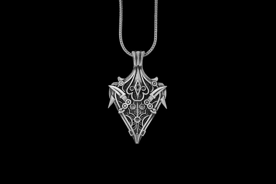 Dark fantasy shield design featuring sharp, armor-like blade accents and a spearhead silhouette.