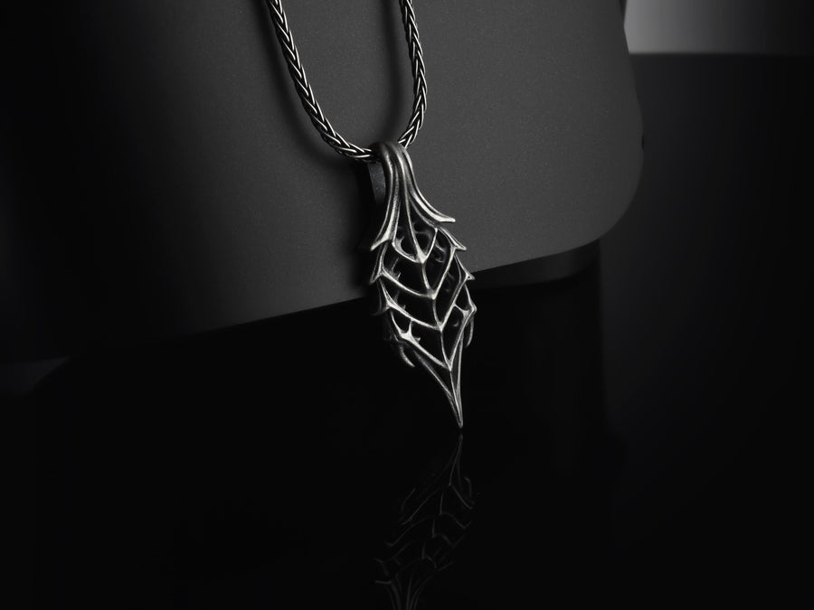 Intricate wireframe skeleton leaf design inspired by dark fantasy lore.