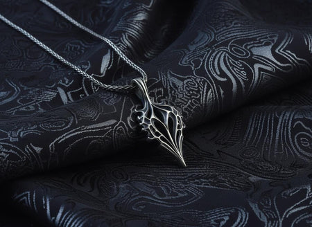 Handcrafted from solid 925 Sterling Silver with a deep oxidized finish to highlight its organic texture.