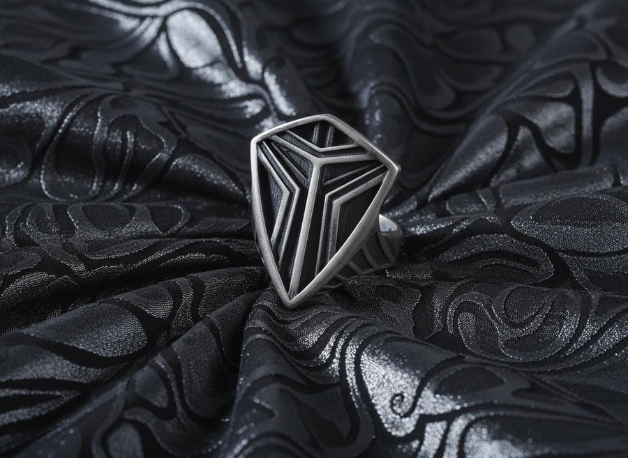 Channel the aesthetic of a high-tech future with this solid 925 sterling silver sci-fi shield ring. Designed with a sleek, low-profile silhouette, this minimalist signet features a sharp geometric crest anchored by deep, oxidized tri-line grooves.