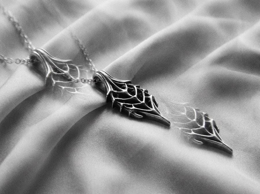 Intricate wireframe skeleton leaf design inspired by dark fantasy lore.