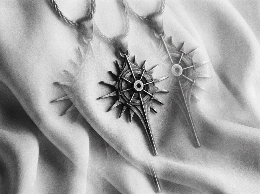 Man wearing a geometric dark fantasy starburst pendant on a silver chain against a black shirt. Celestial Star Silver Pendant for Men, Fantasy Compass Necklace, Gothic Sunburst Amulet, Sci-Fi Artifact, Oxidized Silver Navigator Jewelry