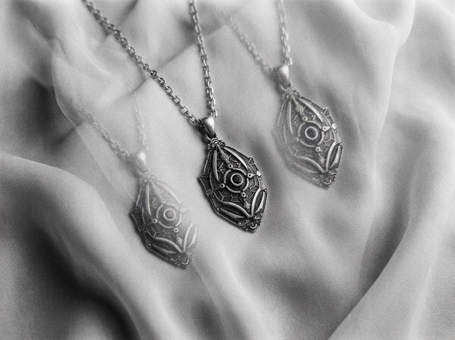 Unique artisan crafted silver armor necklace for men, fantasy sci-fi jewelry, A close-up studio photograph of a 925 sterling silver shield pendant resting on a dark reflective surface. The avant-garde design features geometric plating and a central circular core, highlighted by a dark matte oxidized finish. This striking artisan pendant captures the essence of futuristic armor.