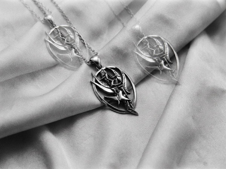 Silver dystopian techwear charm hanging on an anchor chain, emphasizing its rebellious asymmetrical design. A close-up studio photograph of a 925 sterling silver hieroglyph pendant resting on a dark patterned fabric. The avant-garde oval design features a sharp, geometric abstract symbol in the center, highlighted by a dark matte oxidized finish.