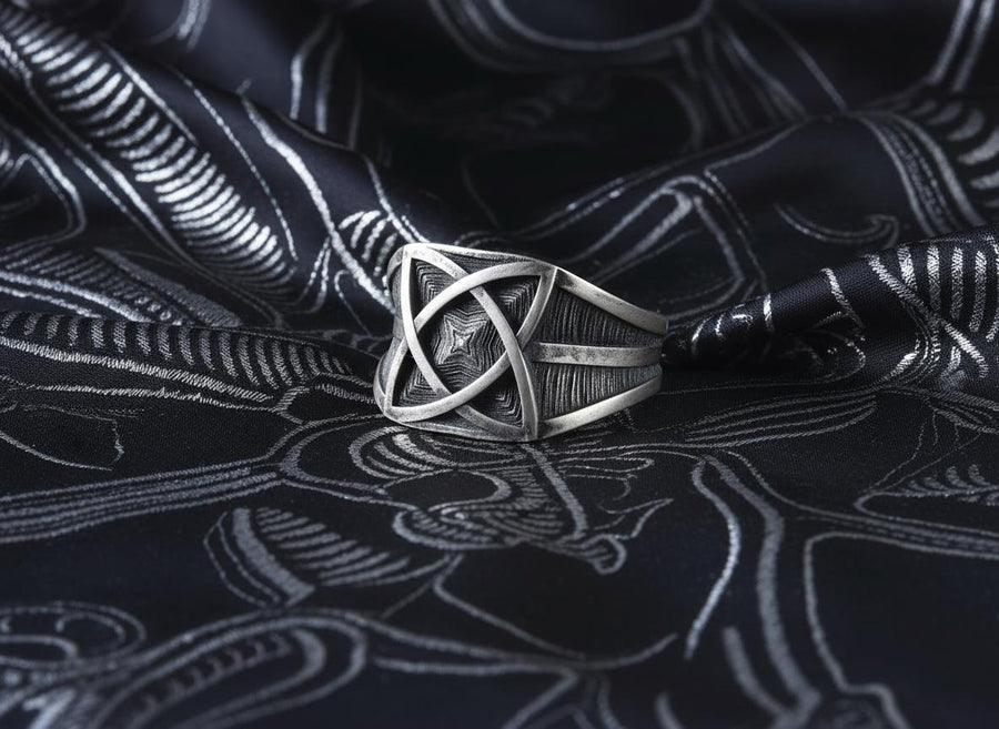 Handcrafted from solid 925 Sterling Silver with a deep oxidized finish to accentuate its textured details.